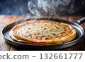 Close-up of a delicious, freshly cooked pancake on a hot frying pan 132661777