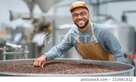 Small business owner smiling while checking roasted coffee beans in roasting facility with industrial equipment in background Small business owner smiling while checking roasted coffee beans in roasting facility with industrial equipment in background 132661812