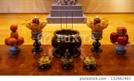 Incense burner and fruits on a Buddhist altar 132662465