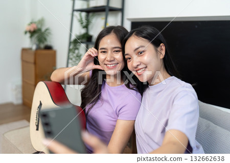 LGBTQIA Friends Taking Selfie with Guitar at Home LGBTQIA Friends Taking Selfie with Guitar at Home 132662638