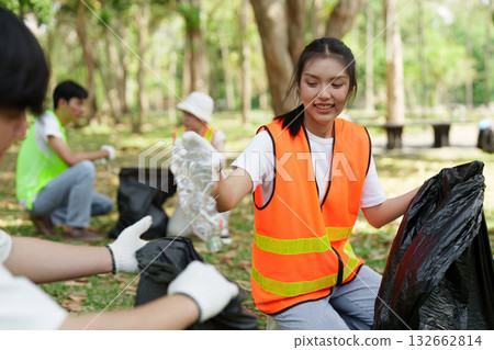 Environmental Stewardship and Action. Participants in an environmental initiative focus on waste management and community care. Environmental Stewardship and Action. Participants in an environmental initiative focus on waste management and community care. 132662814