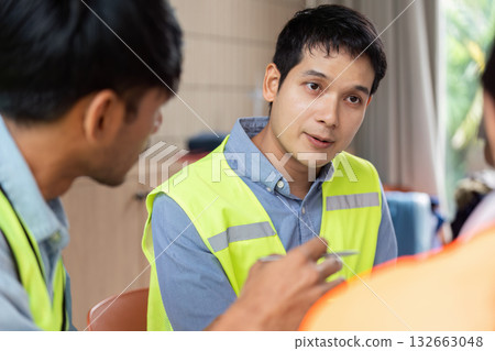 Green tech dialogue among engineers during sustainable project planning 132663048