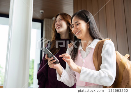 Connection and Study. Students engaged in interactive learning while reviewing materials. 132663260