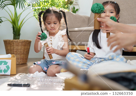 Imagination and Crafting. Kids embracing sustainability through innovative recycled art. 132663350