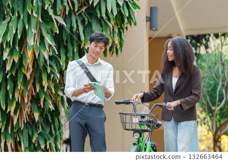 Sustainable Living and Collaborative Learning. Friends discuss sustainability while enjoying a coffee break in a vibrant environment. 132663464