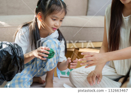 Interactive Recycled Crafts and Sustainable Learning. Children express creativity through eco-friendly projects, emphasizing the value of waste material reuse. 132663467