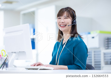 Business woman wearing an intercom Business woman wearing an intercom 132664553