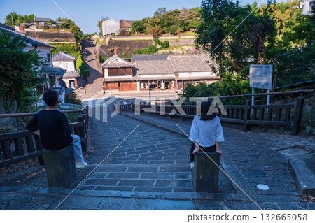 Brother and sister look at Iconic Suya no Saka slope in Kitsuki town 132665058