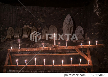candles glow cave by Buddha statue of Okunoin at Futagoji, Oita candles glow cave by Buddha statue of Okunoin at Futagoji, Oita 132665063
