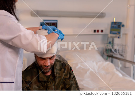 Medical Assistance and Treatment for Injured Soldier Receiving Care in Hospital Setting Medical Assistance and Treatment for Injured Soldier Receiving Care in Hospital Setting 132665191