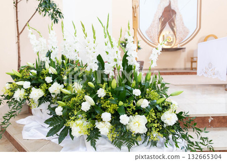 An Elegant White Floral Arrangement Perfect for Various Special Occasions and Events 132665304