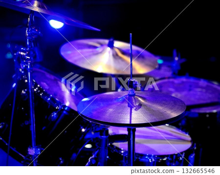 Drum set illuminated by stage lights 132665546