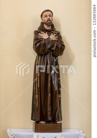 An Elegant and Detailed Statue Beautifully Depicting a Saint Wearing Exquisite and Luxurious Robes 132665664