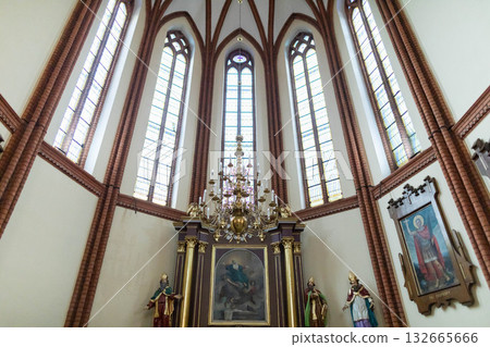 The Gothic Church Interior features beautiful Stained Glass Windows, evoking rich history 132665666