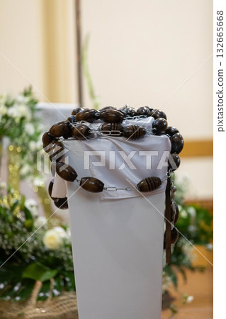 An Elegant Display of Dried Leaf Necklaces Featured at the Floral Arrangement Event 132665668