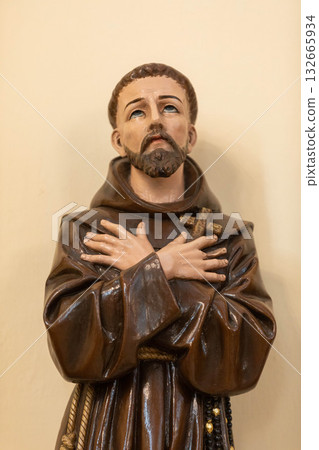 Contemplative Saint in a Prayerful Pose, a Representation of Statuesque Art and Devotion Contemplative Saint in a Prayerful Pose, a Representation of Statuesque Art and Devotion 132665934