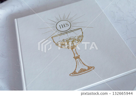 An Elegant First Communion Album Cover featuring a beautifully designed Chalice motif An Elegant First Communion Album Cover featuring a beautifully designed Chalice motif 132665944