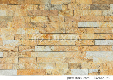 A beautifully crafted Textured Stone Wall featuring harmonious Earthy Tones that enhance any space A beautifully crafted Textured Stone Wall featuring harmonious Earthy Tones that enhance any space 132665960
