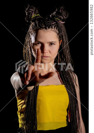 A Dynamic Portrait featuring a Young Model sporting a Unique and Creative Hairstyle 132665982