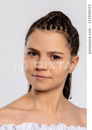 A captivating portrait of a beautiful woman with exquisite braided hair in a studio setting A captivating portrait of a beautiful woman with exquisite braided hair in a studio setting 132666025