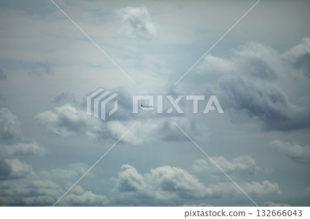 An intriguing and mysterious object has been sighted within the clouds up in the sky An intriguing and mysterious object has been sighted within the clouds up in the sky 132666043