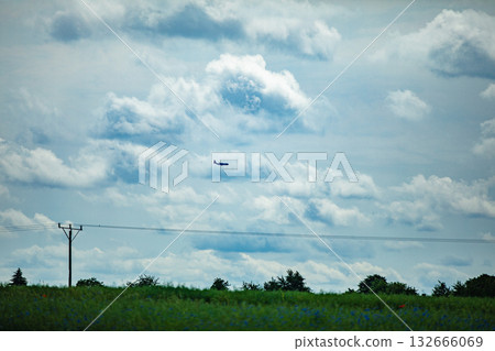 A Mysterious Object Has Been Spotted in the Sky Above the Green Fields of Agriculture 132666069