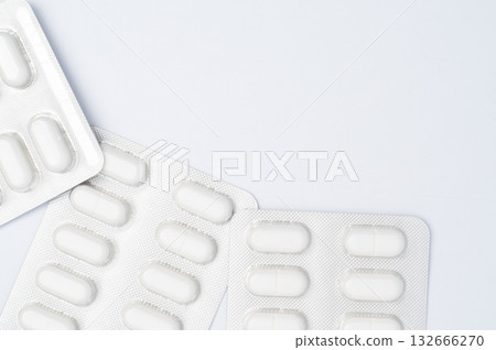 Three pills blister pack on white background, top view medical concept, healthcare, pharmacy, medication, and pharmaceutical product. Copy space 132666270