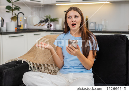 Young woman learns language on smartphone repeats phrases gets score streak and celebrates progress 132666345