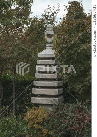 Japanese Stone Pagoda in Green Garden. Tranquil Oriental Landscape 132666433