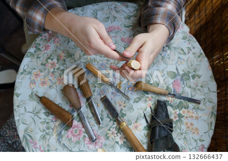 Man Carving Wood by Hand. Traditional Woodworking and Craftsmanship Tools 132666437