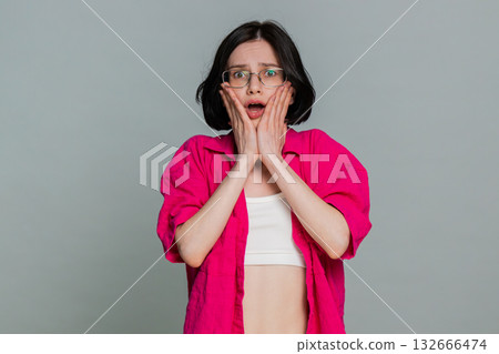 Woman sighs with disappointment covering face expressing sadness after failure or bad news reaction 132666474