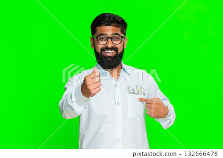 Indian man making money gesture confident expression showing wealth success cash sign chroma key Indian man making money gesture confident expression showing wealth success cash sign chroma key 132666478
