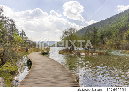 Lijiang, China - April 10, 2024 : Crowd of tourist walking on pathway at Blue Moon Valley lake in Lijiang, China on April 10, 2024 132666564