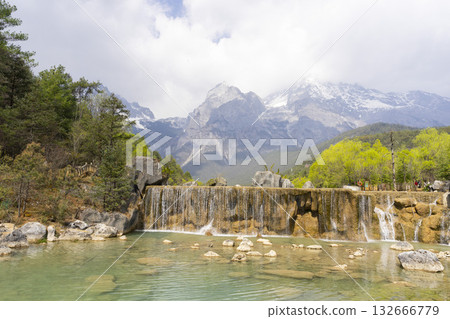 Lijiang, China - April 10, 2024 : Crowd of tourist travel at Blue Moon Valley lake in Lijiang, China on April 10, 2024. Lijiang, China - April 10, 2024 : Crowd of tourist travel at Blue Moon Valley lake in Lijiang, China on April 10, 2024. 132666779