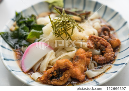 Deep fried octopus and grated daikon udon noodles 132666897