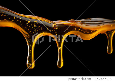 黑色背景上的蜂蜜流動，美不勝收。 132666920