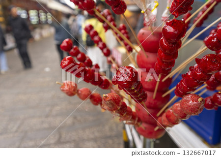 Lijiang, China - April 12, 2024 : Local food stall shop at flea market in Lijiang Old Town, China on April 12, 2024. 132667017