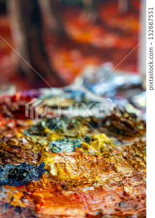 A painter at work in a cozy studio full of paintings. Capturing the artistic process and atmosphere. A painter at work in a cozy studio full of paintings. Capturing the artistic process and atmosphere. 132667551