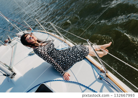 Woman relaxing on sailboat enjoying summer vacation 132667993