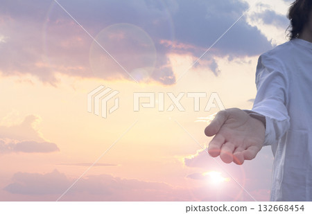 Jesus Christ giving his arm, hand gestures of Jesus dying on the cross and resurrected 132668454