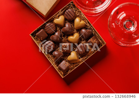 A glasses of champagne elegantly paired with a box of rich chocolates 132668946