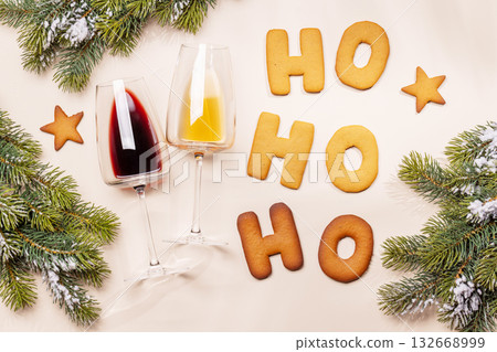 Ginger cookies shaped as Ho Ho Ho with fir branches , Christmas card style Ginger cookies shaped as Ho Ho Ho with fir branches , Christmas card style 132668999