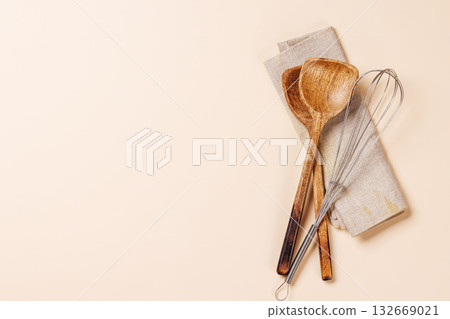 Kitchen utensils on beige table Kitchen utensils on beige table 132669021