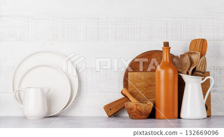 Kitchen utensils and cutting boards on table Kitchen utensils and cutting boards on table 132669096