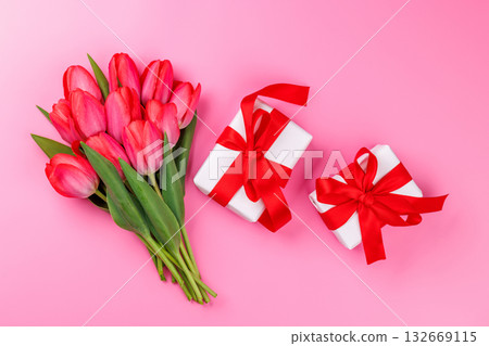 Pink tulip bouquet and gift boxes on a soft pink background Pink tulip bouquet and gift boxes on a soft pink background 132669115