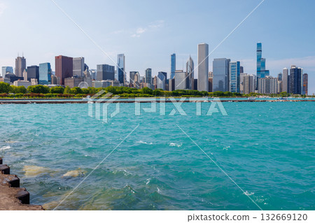 Bright and sunny view of downtown Chicago with the shimmering Michigan lake in the foreground 132669120