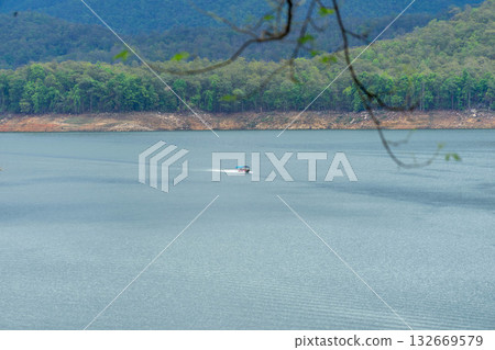 Tourist Boat Cruising on Lake in Thailand 132669579