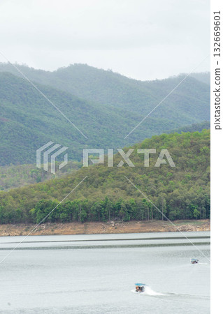 Tourist Boat Cruising on Lake in Thailand Tourist Boat Cruising on Lake in Thailand 132669601