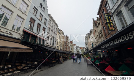 Sidewalk cafe restaurants on the narrow street in Antwerp Sidewalk cafe restaurants on the narrow street in Antwerp 132669879