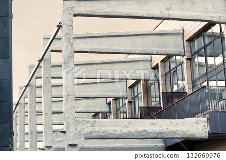 Brutalist Concrete Building Facade with Angular Geometric Architecture 132669976